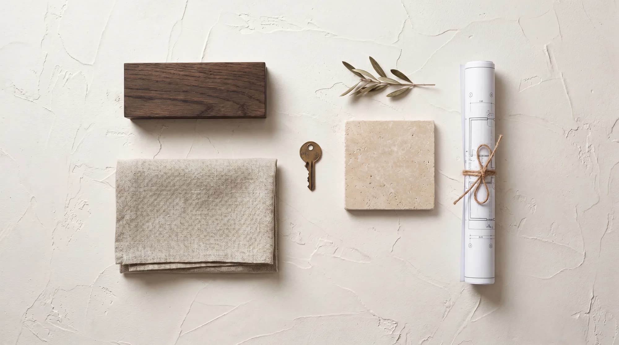 Materials around the home: oak, linen, stone and a brass key
